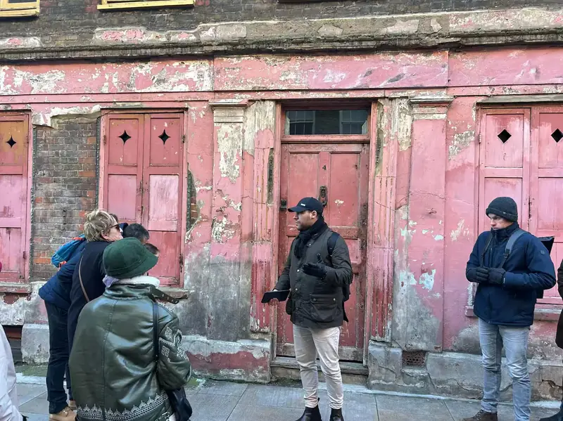 A tour group listening to their guide on Princelet Street
